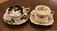 Both teacup and saucer sets front view