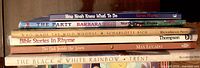 Spines of all six hardcover books stacked