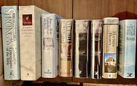 All eight book spines side by side