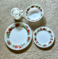 Dinner plate, salad plate, bowl, mug displayed on carpet