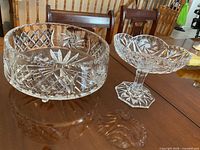 Bowl and pedestal dish side by side on table