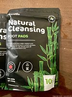 Front view of Natural Cleansing Foot Pads package showing brand, product name, 10-pad count