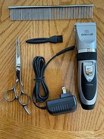 Clipper with charger, scissors, metal comb and cleaning brush
