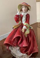 Front view of figurine showing full attire and pose