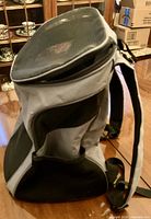 Side view of grey/black mesh dog backpack carrier