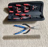 Case with Craftsman mini pliers, Plato cutter, round-nose plier, ruler