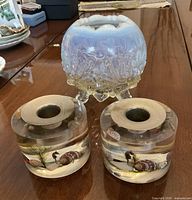 Compote and both lucite candle holders on table