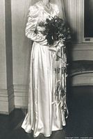 Bride wearing the satin gown in 1946 black-and-white photo