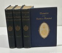Spines and front board of all three volumes plus one front cover displayed