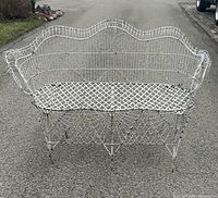 Front view of white metal wire settee bench