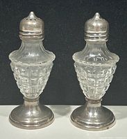 Front view of both shakers showing overall form and materials