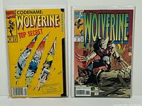 Front view of both Wolverine comics #50 and #77 in bags
