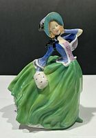 Front view of Royal Doulton “Autumn Breezes” figurine showing overall form and colors