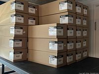 Stacked cartons labeled TN229XL showing quantity