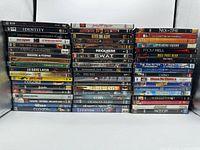 Two stacks of DVDs, front view, showing spines and quantity