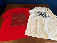 Both Crooks & Castles T-shirts laid flat