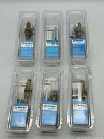 Six Moen 1225B cartridges in sealed packaging
