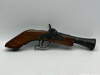 Left side view of entire toy cap gun