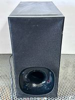 Front view showing cabinet and bass port