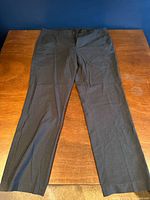 Full view of pants laid flat showing color, style and leg length
