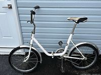 Full side view of folded Rog Pony bicycle showing overall condition