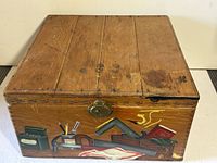 Closed box showing top and painted front