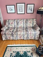 Front view of full three-seat sofa showing upholstery pattern, cushions, arms, and frame