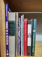 Row of book spines showing titles and authors