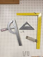 All measuring and layout tools hanging on pegboard