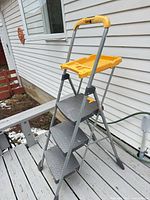 Full view of Cosco 3-step folding ladder with yellow tray