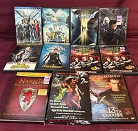 All eleven DVD cases arranged face-up showing cover art and titles