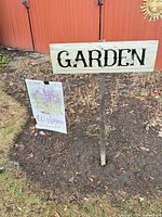 Wood sign and flag displayed outdoors