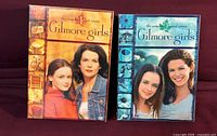 Front view of both Gilmore Girls Season 1 and Season 2 DVD box sets
