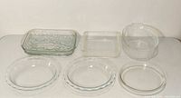 Overall view of six main glass bakeware pieces and casserole lid