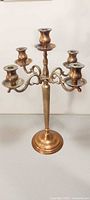 Front view showing brass five-light candelabra