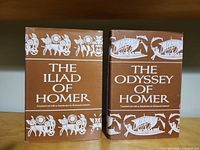 Front covers of both books showing titles and Greek motif artwork