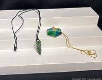 Both necklaces laid out showing full view