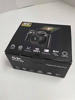 Sealed retail box showing 5K Ultra HD branding, WiFi, 18X digital zoom, IPS HD screen