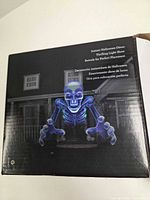 Back of box showing projected skeleton image and feature text