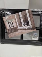 Sealed Namsan pet screen door with marketing insert visible