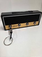 Front view of Jack Rack with one plug keychain inserted