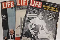 Three LIFE magazines overlapped: visible April 26 1963 Jackie Growing Up, LBJ Big Show, and an issue with soldier on snowy ground