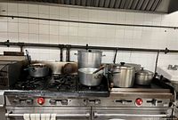 Front view of Vulcan gas range showing burners, ovens, control knobs