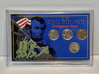 Front view of plastic case showing four 1943 steel cents and patriotic insert
