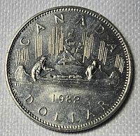 Reverse showing Voyageur canoe design and 1982 date