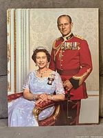 Front view of one photographic print depicting the formal royal couple portrait