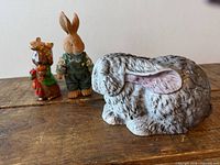 All three rabbit figurines grouped on tabletop