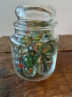 Jar of large marbles, lid on