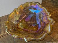 Top view showing iridescent marigold finish and leaf-shaped scalloped rim