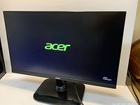 Front view of Acer KC242Y monitor on stand, screen powered on